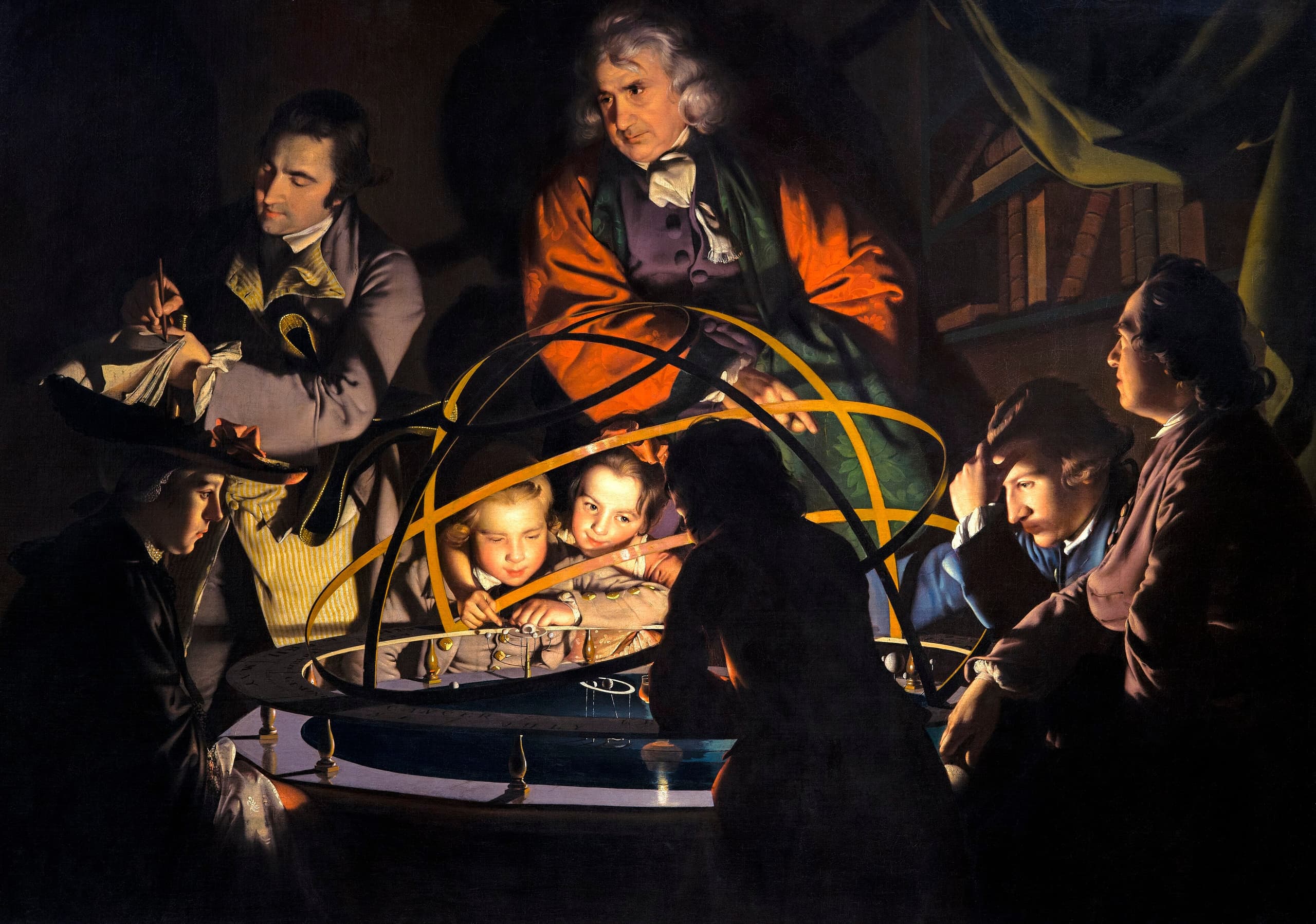 A dark interior. A group of adults and children press close around a large brass mechanical model of the solar system, its globes held out on metal arms. Light comes from within the model itself, catching the underside of faces and hands while the room beyond dissolves into brown shadow. An older man leans over the mechanism, mid-explanation.