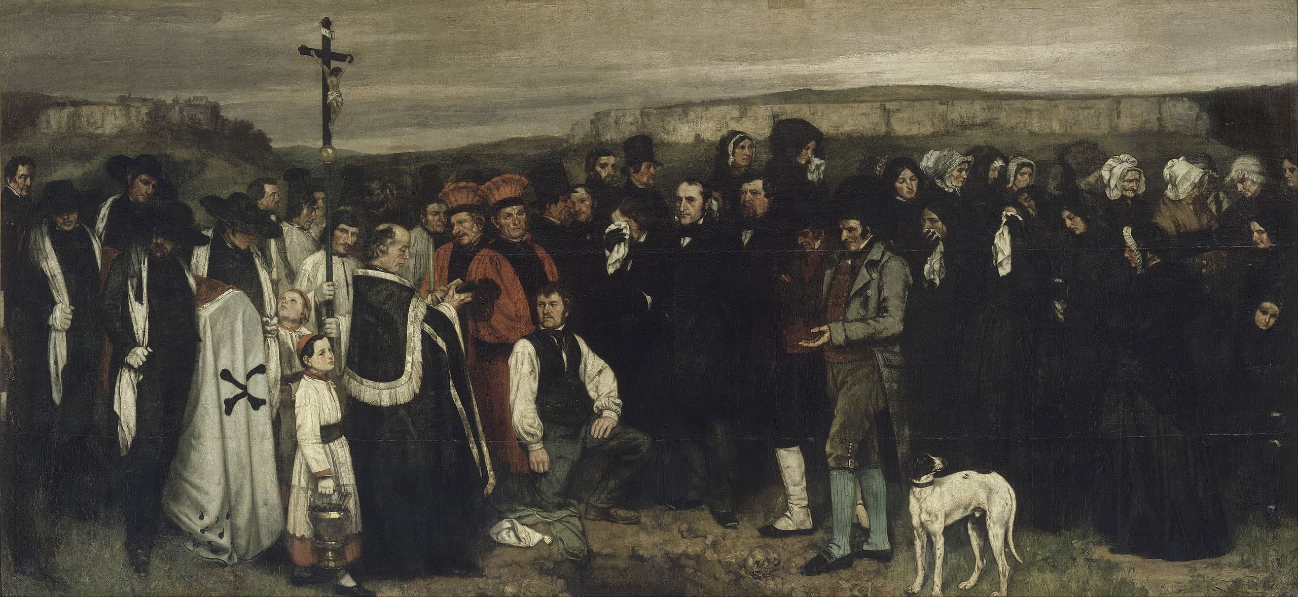A long row of villagers in black, standing around an open grave in pale earth. Clergy in white robes hold a crucifix. A white dog stands in the foreground. The sky is overcast.