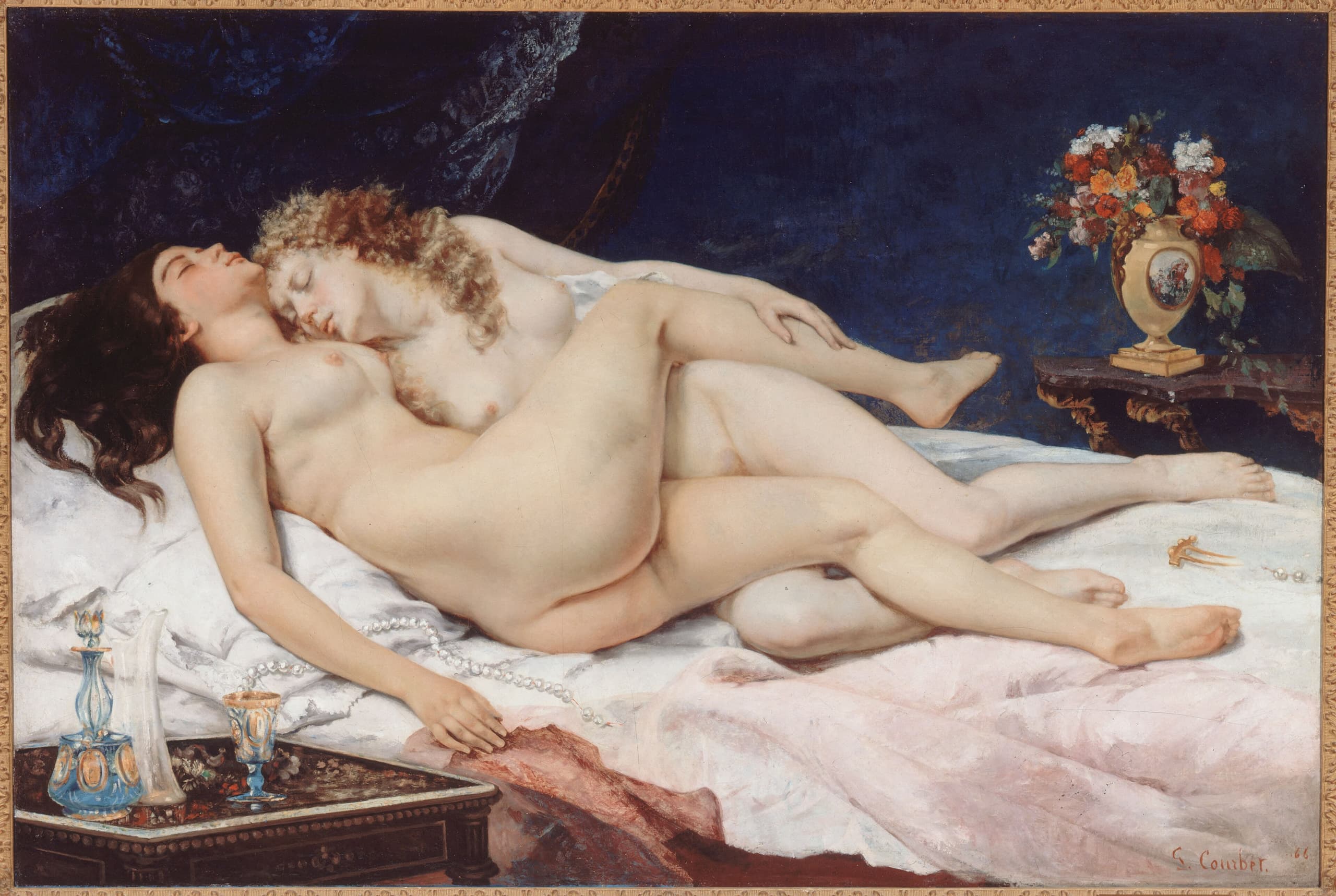 A wide oil painting of two nude women asleep together, their bodies closely entwined across a bed-like surface in soft, even light.