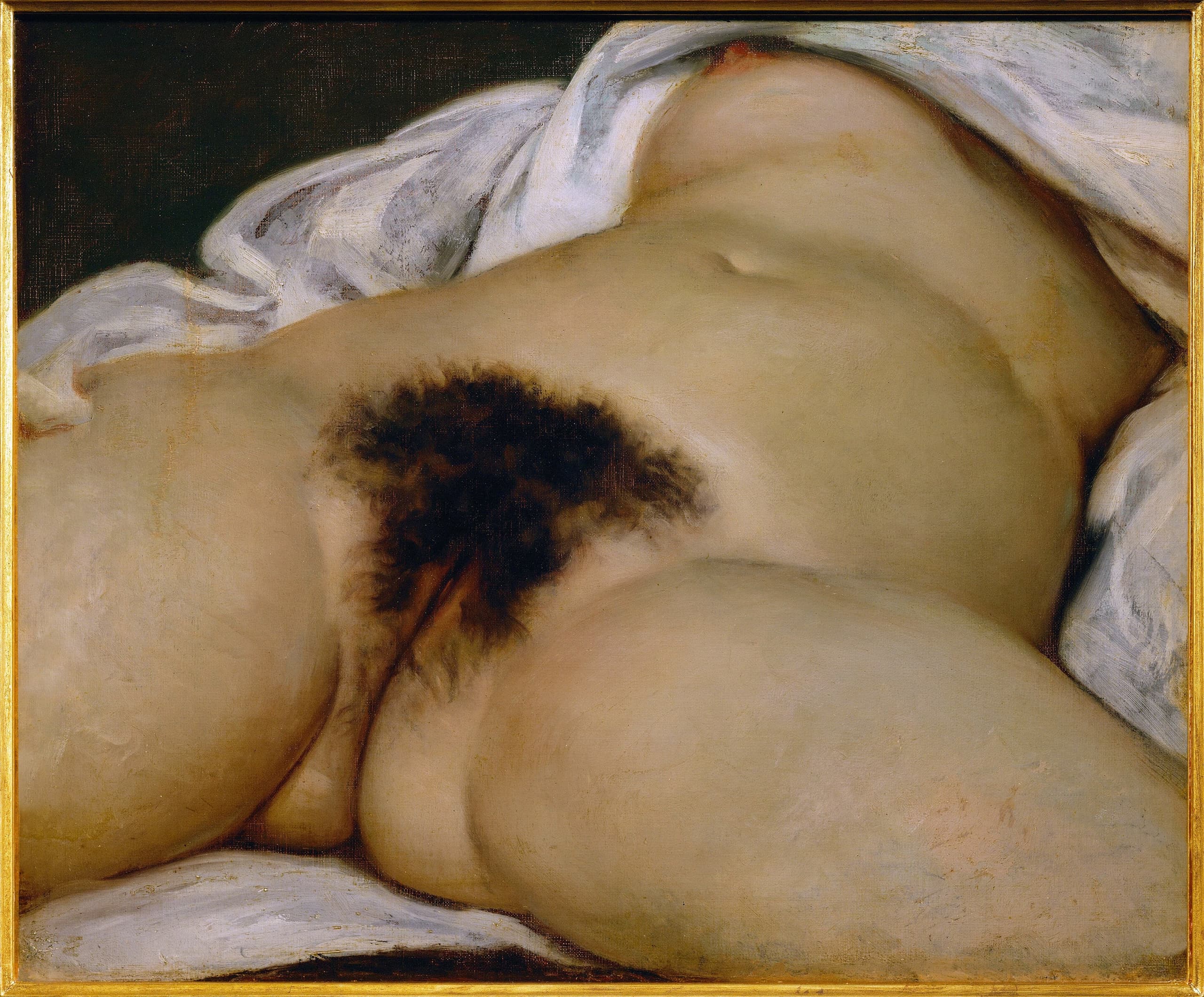 Close view of a naked woman’s abdomen, genitals and open thighs on white bedding; the torso is cut off before the head, the legs before the knees.