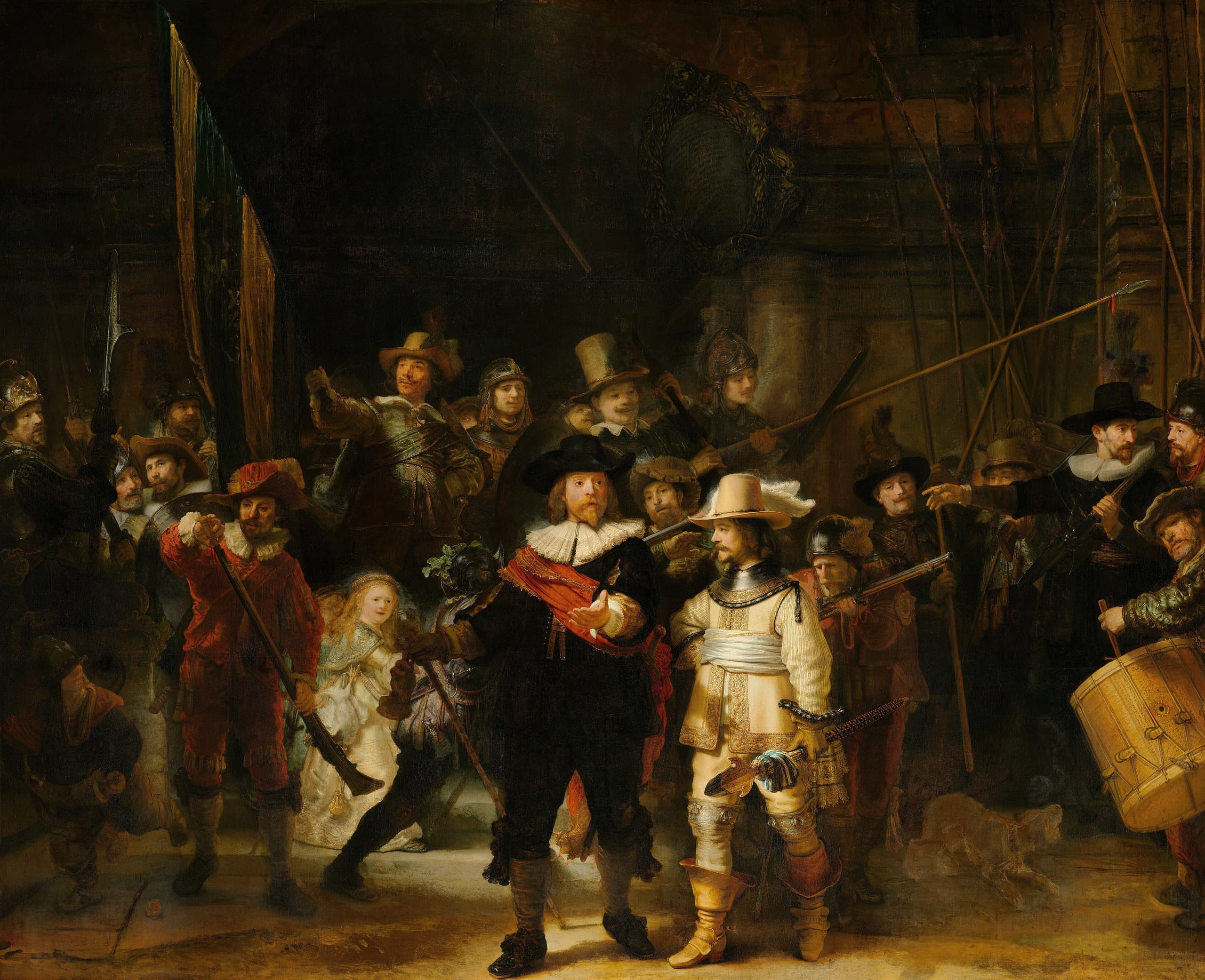 A large group of militia members in seventeenth-century dress, some in shadow, some brightly lit. A man in black with a red sash gestures forward; beside him a man in yellow holds a long spear. A girl in gold stands in the middle ground, and pikes and muskets cross the composition.