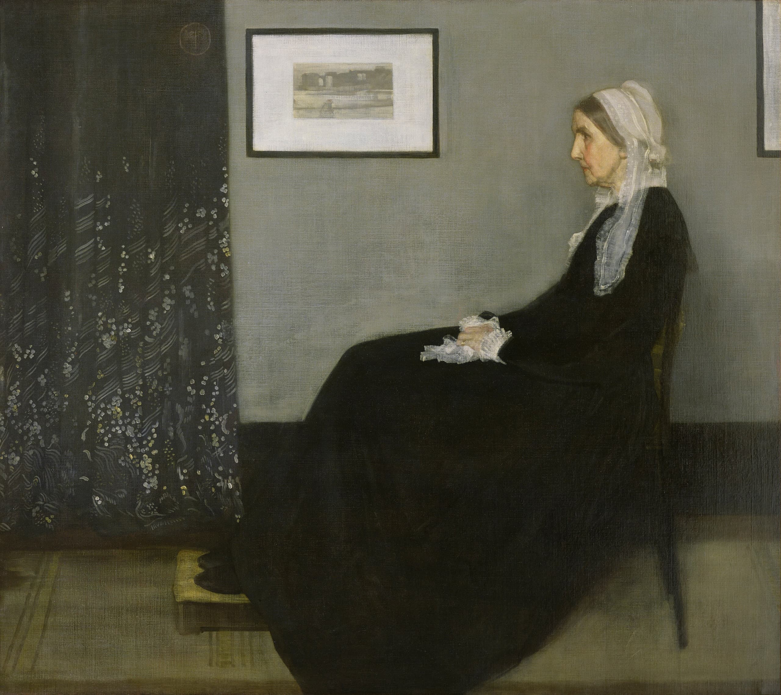 An elderly woman in a black dress and white cap sits in strict profile facing left against a grey wall, with a dark curtain at one side and a small framed print above.