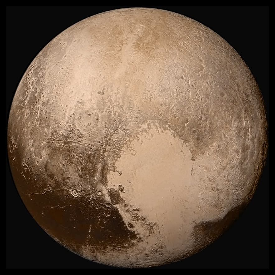 A pale, mottled sphere with light and dark regions, showing a surface of varied terrain including smooth plains and rougher areas, photographed against the black of space.