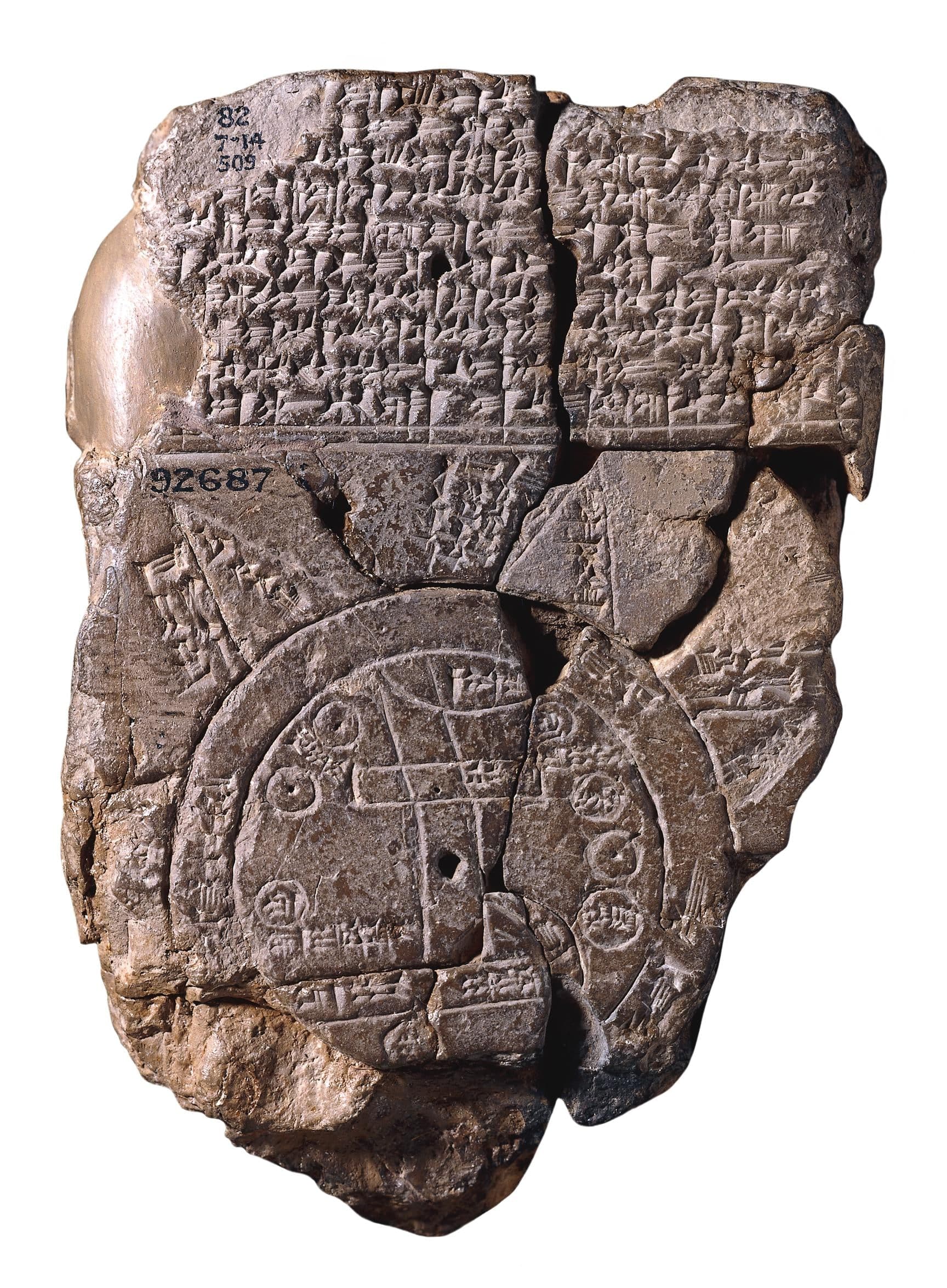 A broken clay tablet inscribed with cuneiform text and a circular diagram showing a disc of land with a vertical river, surrounded by a double ring and triangular projections.
