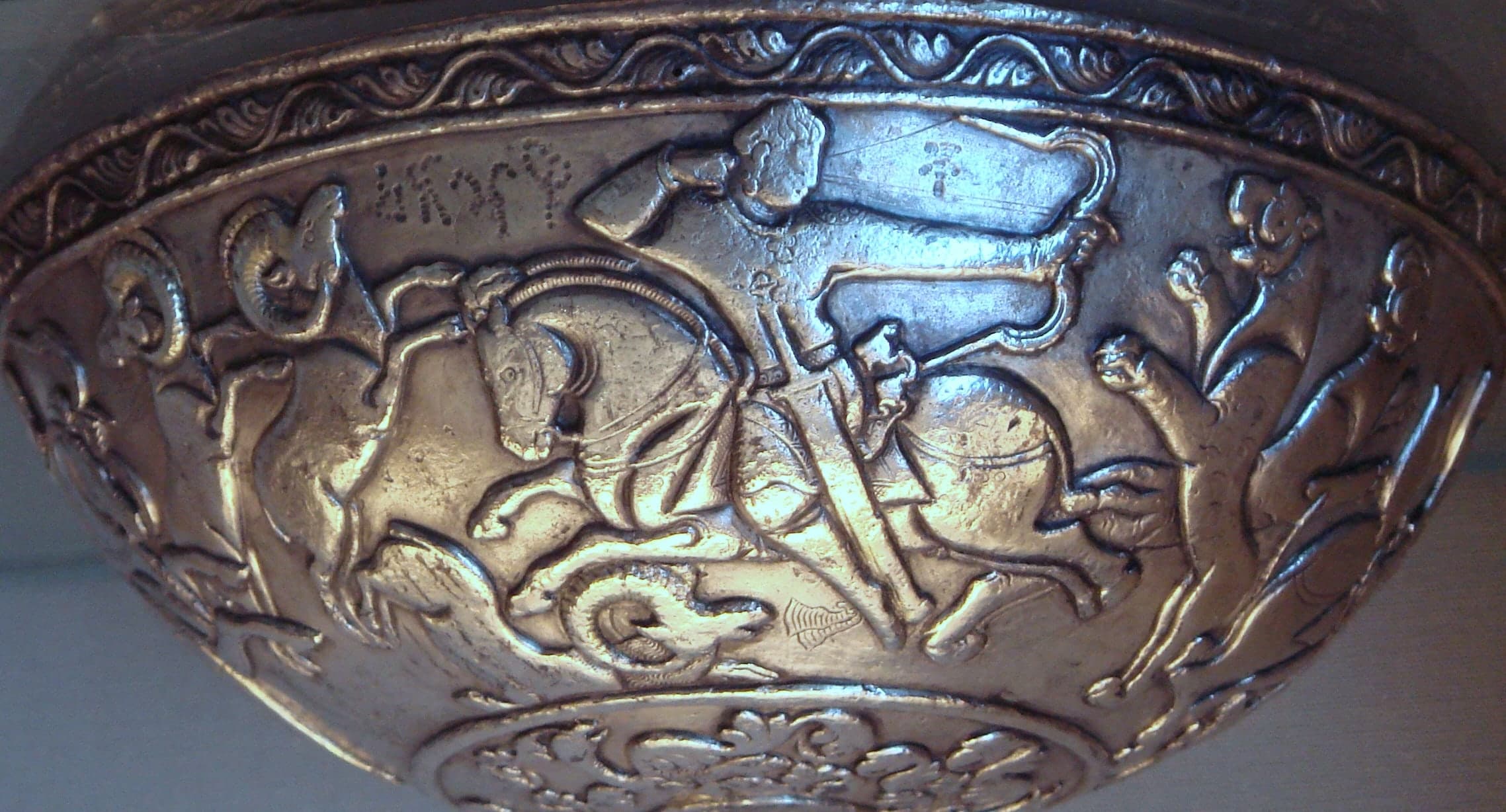 A silver bowl attributed to the Hephthalite period, linked to fifth-century Gandhara and associated with imagery of two Huna tribes.