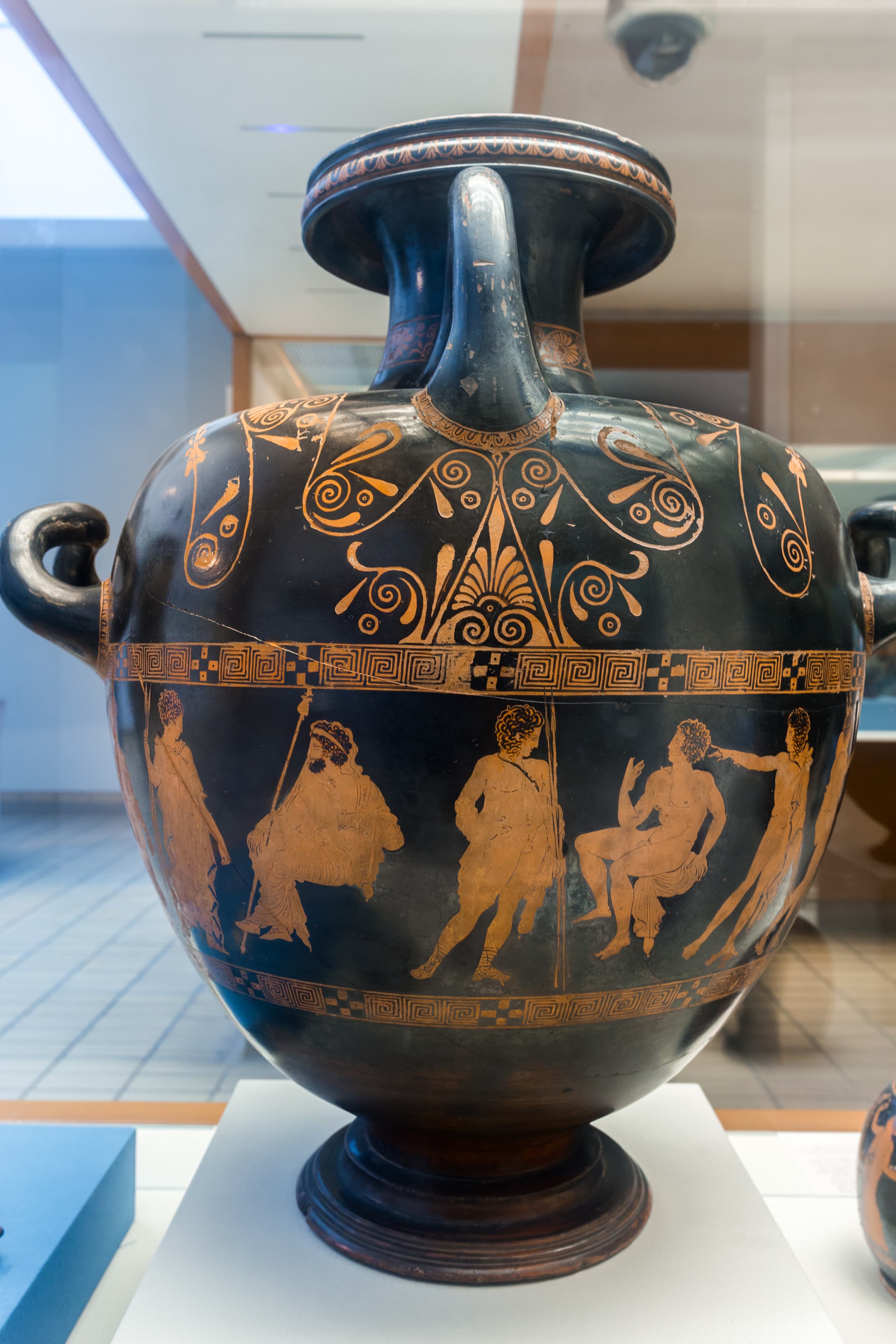 An ancient Greek red-figured hydria: a rounded water-jar whose painted figures are left in the clay colour against a darkened ground, of the type attributed to the Meidias Painter.